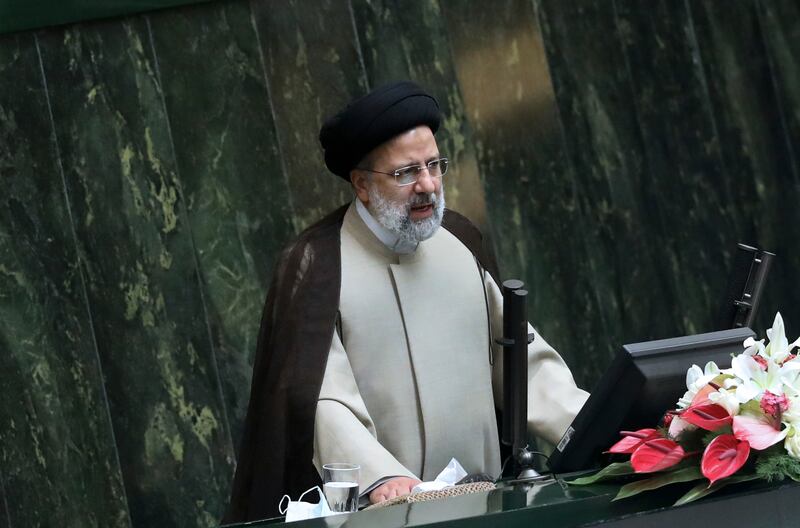 Iranian President Ebrahim Raisi addresses during a joint session of politicians and cabinet members at the parliament, in Tehran, Iran, Wednesday December 1 2021. AP