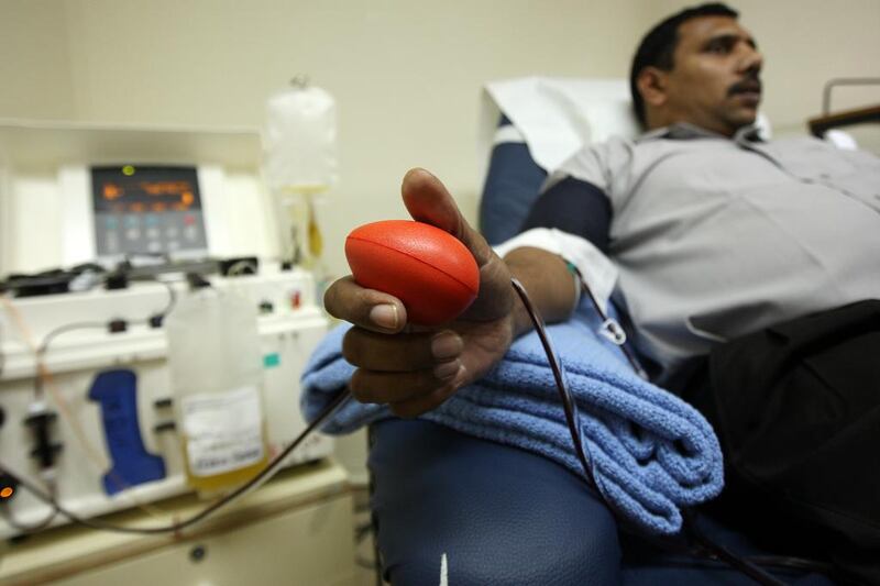 Ateith Kumar from India relaxes during the donation process, which takes less than 30 minutes, at Al Wasl hospital in Dubai. Pawan Singh / The National