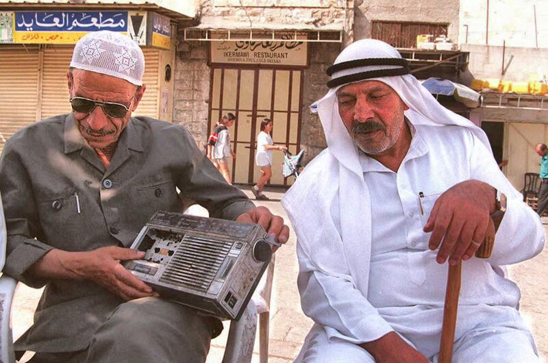 Palestinians listen to the radio for the latest results of Israeli elections in Jerusalem's Old City 30 May. An Arab League official said Arab nations have "something to worry about" if Likud leader Bibi Netanyahu becomes Israel's next prime minister.      AFP PHOTO  Awad AWAD (Photo by AWAD AWAD / AFP)