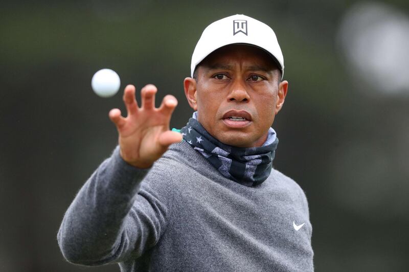 Tiger Woods catches a ball during a practice round prior to the 2020 PGA Championship at TPC Harding Park. AFP