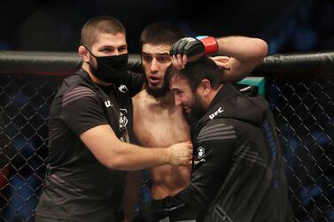 Coach Khabib Nurmagomedov celebrates the win with his fighter Islam Makhachev. UFC lightweight bout between Dan Hooker (blue) and Islam Makhachev (red) at UFC 267. Etihad Arena, Yas Island, Abu Dhabi