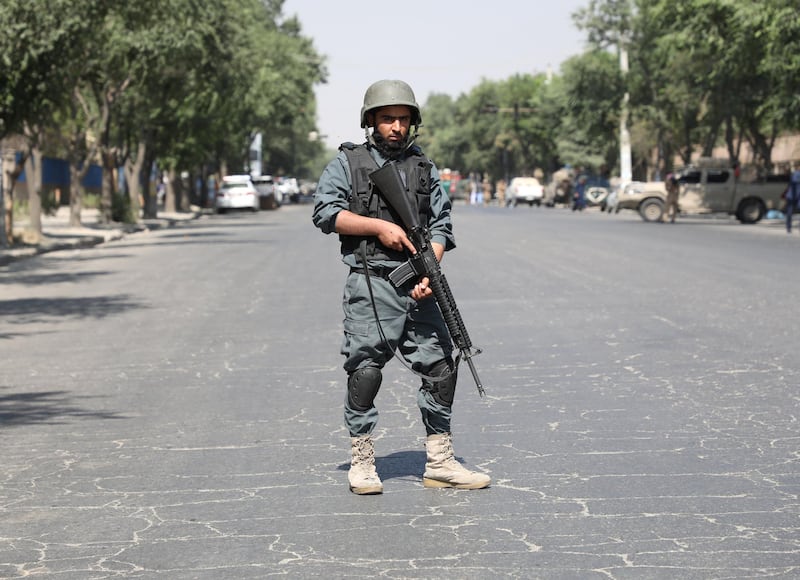 A policeman keeps watch at the site of the blast. Reuters