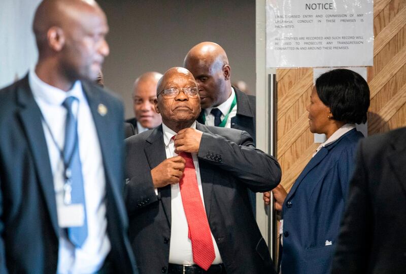 Former South African president Jacob Zuma (C) arrives to appear before the Commission of Inquiry into State Capture on July 15, 2019 in Johannesburg, where he faces tough questioning over allegations that he oversaw systematic looting of state funds while in power. Zuma on July 15 dismissed multiple graft allegations against him, telling a judicial inquiry he was the victim of conspiracies, years of "character assassination" and plots to kill him, telling a judicial inquiry he was the victim of conspiracies, years of "character assassination" and plots to kill him. Zuma testified at the inquiry in Johannesburg into the so-called "state capture" scandal after previous witnesses gave damning evidence against him. / AFP / POOL / WIKUS DE WET
