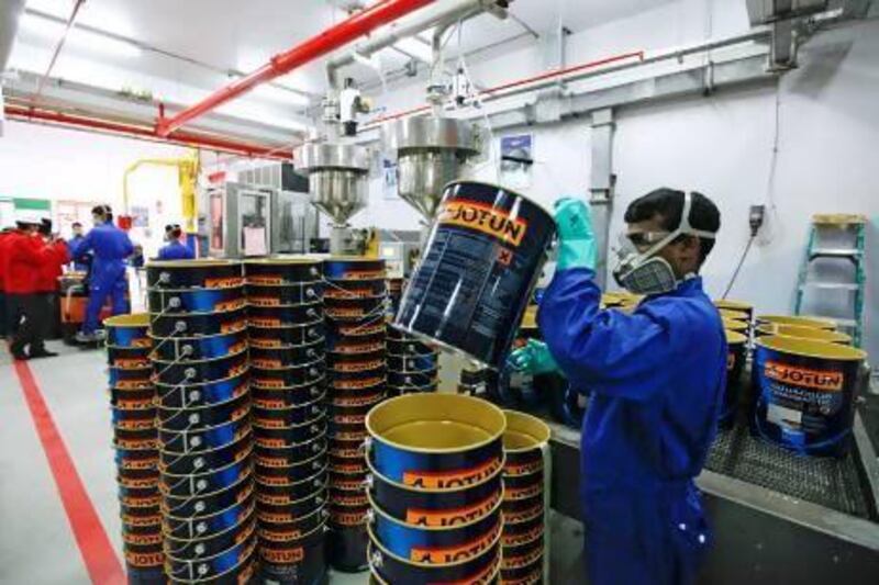 Inspectors from the Abu Dhabi Environment Agency carry out a routine environmental check at a Jotun paint manufacturing factory in Abu Dhabi. Sarah Dea / The National