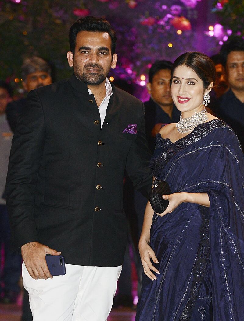 Indian Cricketer Zaheer Khan poses for a picture with his wife and actress Sagarika Ghatge on June 30, 2018. AFP