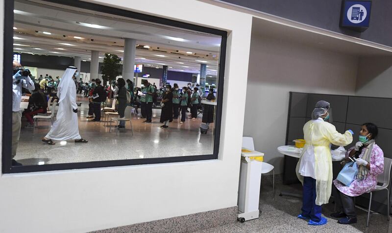 Members of an Indian medical team arrive at Dubai International Airport to help with the coronavirus (COVID-19) pandemic.   AFP