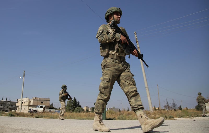 Turkish soldiers patrol the northern Syrian Kurdish town of Tal Abyad, on the border between Syria and Turkey. AFP