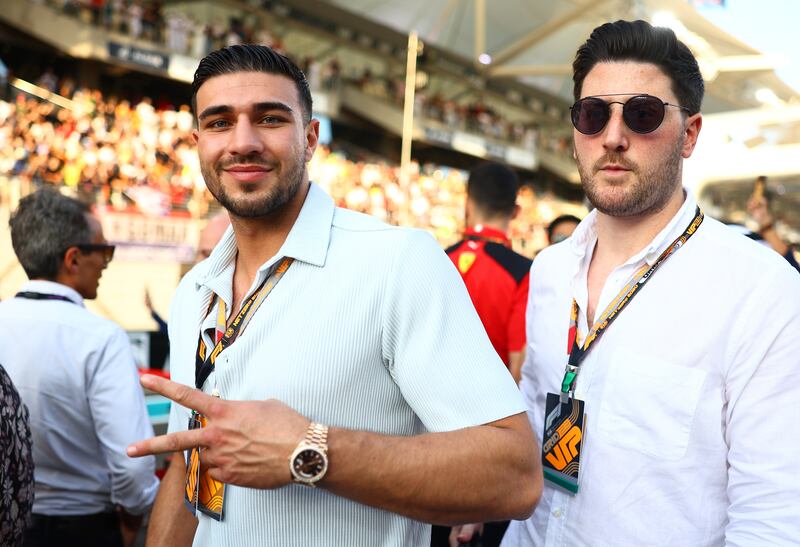 Tommy Fury poses for a photo on the grid before the race. Getty Images