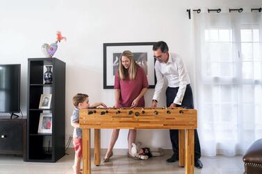 Jorge Camarate and wife Emma Ashworth with their two-year-old son Daniel at their rented villa in the Springs. The couple have taken advantage of the euro's decline by purchasing a property in Lisbon. Reem Mohammed / The National