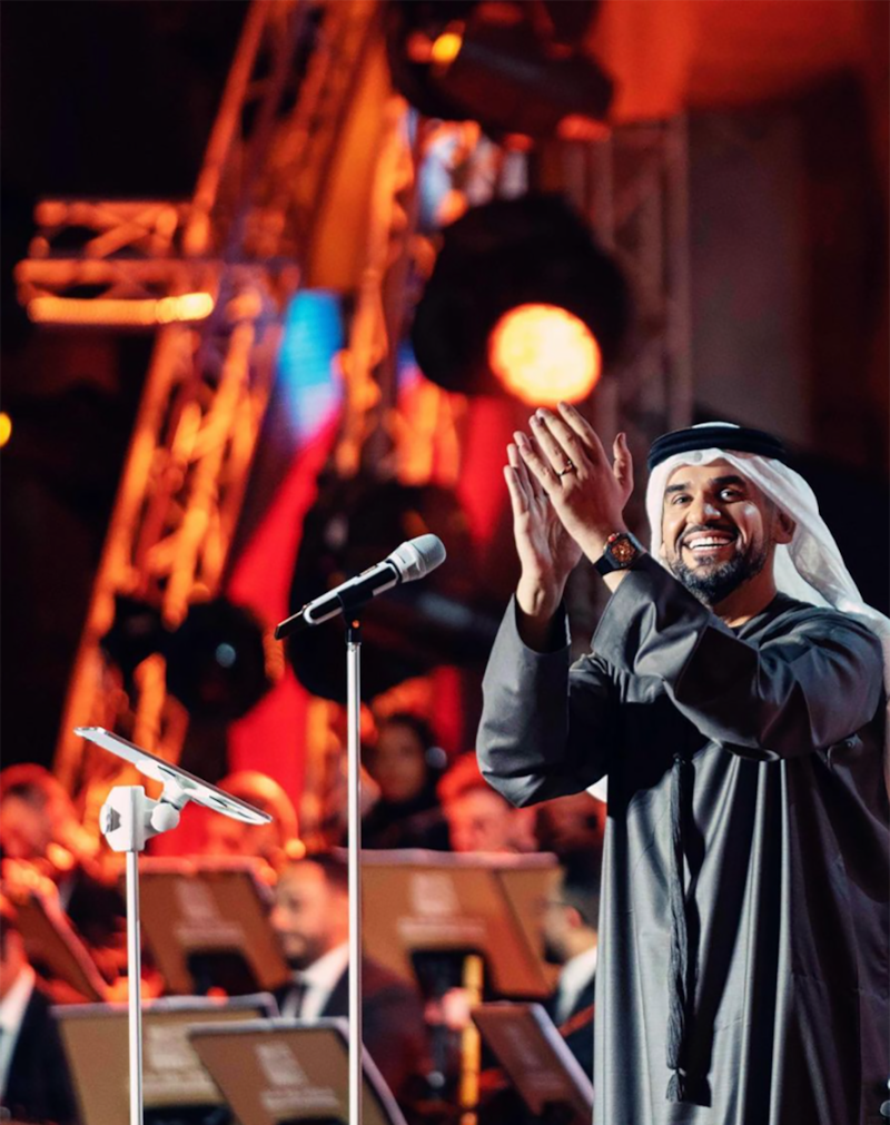 Hussain Al Jassmi performs in Khor Fakkan on New Year's Eve 2023. Photo: Instagram / 7sainaljassmi