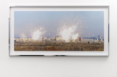 Zhanna Kadyrova's large-scale photograph 'Experiments' (2014), uses acid to burn and mark the image of a Kyiv skyline. Photo: Galleria Continua