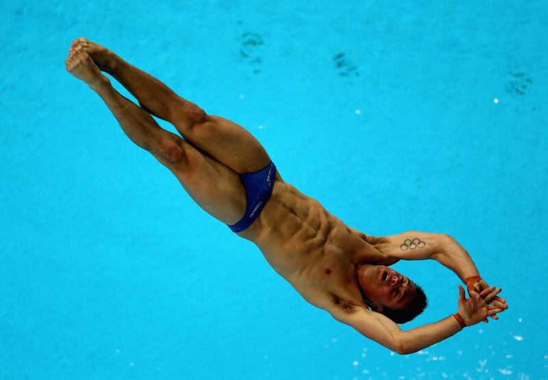 Tom Daley of Great Britain dives at the Fina Diving World Series 2014 at the Hamdan Sports Complex. Warren Little / Getty Images   