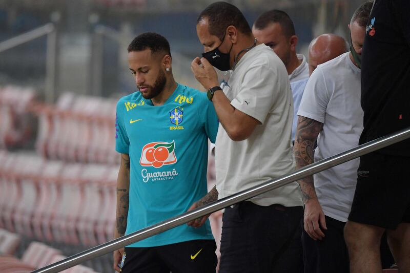 Brazil's Neymar talks to his father Neymar Santos Sr after a training session at the Arena da Amazonia Stadium on October 13, 2021, on the eve of the Qatar 2022 World Cup Qualifier match against Uruguay. AFP
