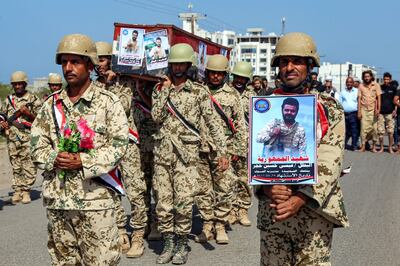 Fighters loyal to Yemen's Saudi-backed government march during a mass funeral for fellow fighters, killed during clashes with Houthi rebels, in Hodeida last October. AFP
