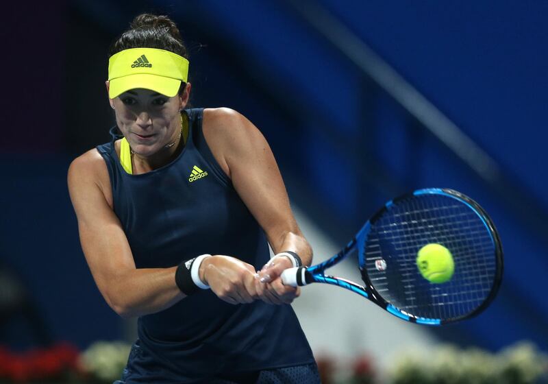 DOHA, QATAR - MARCH 06: Garbine Muguruza of Spain plays a backhand in her Final singles match against Petra Kvitova of The Czech Republic  during Day Six of the Qatar Total Open 2021 at Khalifa International Tennis and Squash Complex on March 06, 2021 in Doha, Qatar. (Photo by Mohamed Farag/Getty Images)