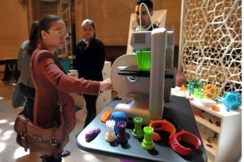 A woman inspects a 3D printer, the likes of which may one day see us printing food and other products at home. Wang Fang / Xinhua Press / Corbis