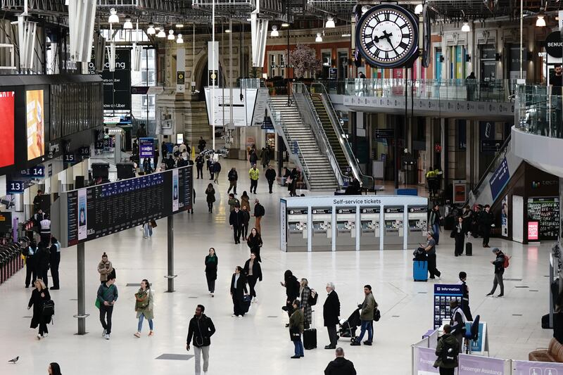 Passengers at Waterloo Station in London, as members of train drivers' union Aslef are preparing for more strike action in a long-running dispute over pay. PA