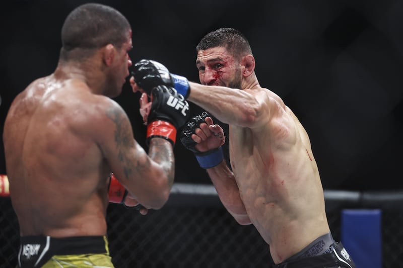 Khamzat Chimaev punches Gilbert Burns in ther welterweight bout at UFC 273. Getty
