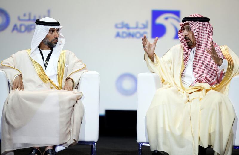 epa07160460 Minister of Energy and Industry of the United Arab Emirates H.E. Suhail Mohamed Al Mazrouei (L) listens as Chairman of the JMMC and Minister of Energy Industry and Mineral Resources of the Kingdom of Saudi Arabia Khalid A Al-Falih (R) speaks during a session at the opening ceremony of Abu Dhabi International Petroleum Exhibition and Conference (ADIPEC) in Abu Dhabi, United Arab Emirates, 12 November 2018. ADIPEC, a meeting place of the international oil and gas community, runs between 12 and 15 November 2018.  EPA/ALI HAIDER