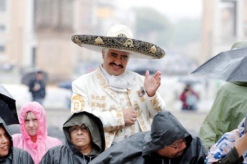 A Mexican faithful waits for the Pope during the weekly general audience at the Vatican. Reuters