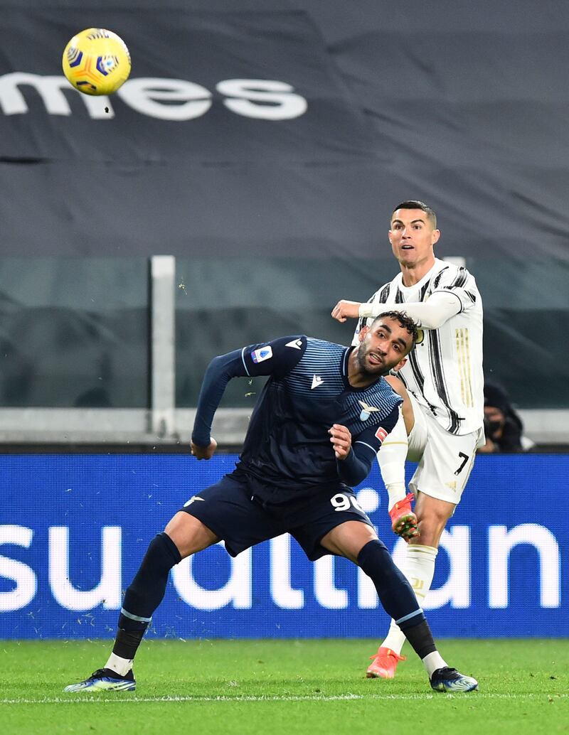 Juventus' Cristiano Ronaldo in action with Lazio's Mohamed Fares. Reuters