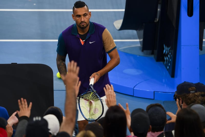 epa09001019 Nick Kyrgios of Australia hands his smashed racquet to fans after winning his second Round Men's singles match against Ugo Humbert of France on Day 3 of the Australian Open at Melbourne Park in Melbourne, Australia, 10 February 2021.  EPA/JAMES ROSS AUSTRALIA AND NEW ZEALAND OUT