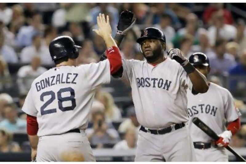 Boston Red Sox's David Ortiz, right, celebrates his two-run home run with Adrian Gonzalez.