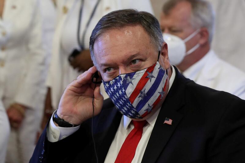 U.S. Secretary of State Mike Pompeo adjusts his earphones during a Te Deum as part of the swearing-in ceremony of Dominican Republic's new President Luis Abinader in Santo Domingo, Dominican Republic August 16, 2020. REUTERS/Ricardo Rojas     TPX IMAGES OF THE DAY