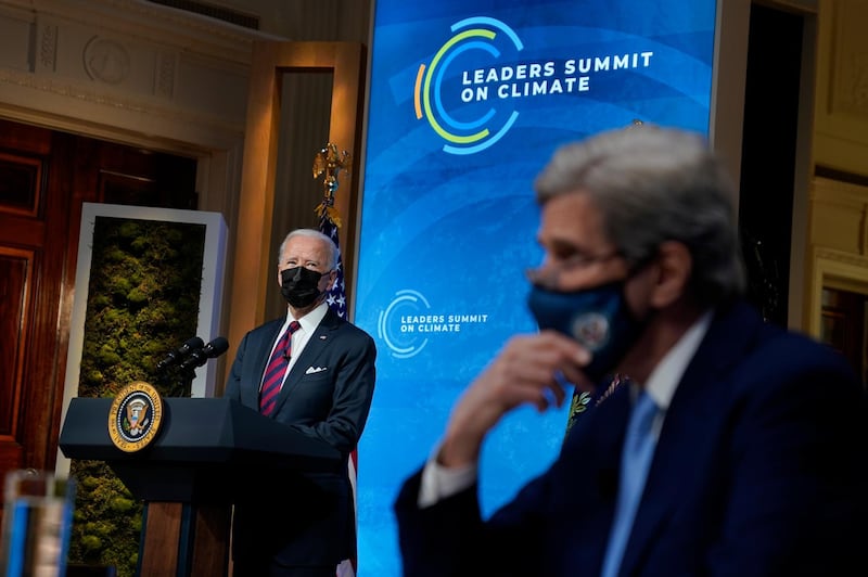 US President Joe Biden speaks to the virtual Leaders Summit on Climate as Special Presidential Envoy for Climate John Kerry looks on. AP Photo