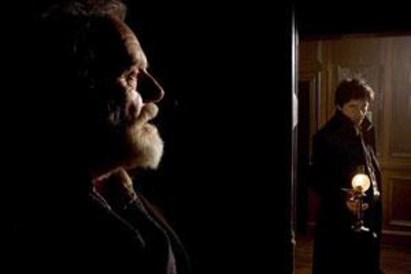 Anthony Hopkins as Sir John Talbot and Benicio Del Toro as Lawrence Talbot in The Wolfman.
