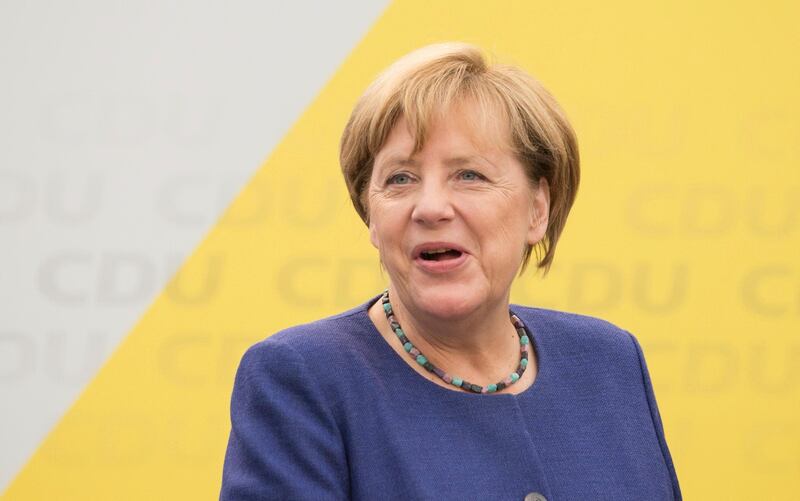 German Chancellor and top candidate of the Christian Democratic Union, CDU, Angela Merkel speaks during an election campaign in Delbrueck, western Germany, Sunday, Sept. 10, 2017. (Friso Gentsch/dpa via AP)