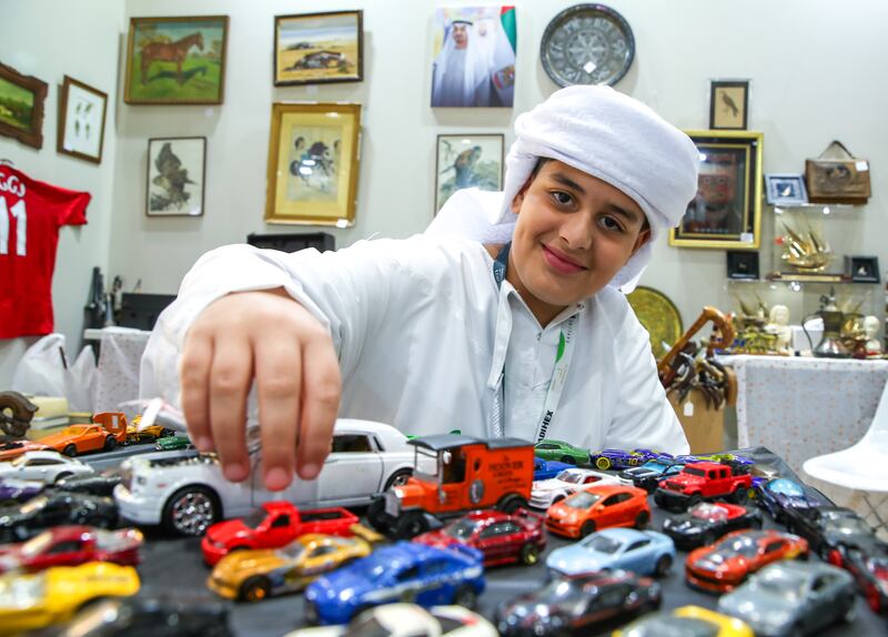Ahmed Mansour at his father's UK Antiques Events stall at Adihex. Victor Besa / The National