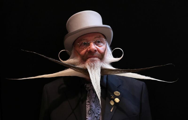 A participant of the international World Beard and Moustache Championships poses before taking part in one of the 17 categories of beard and moustache styles competing in Antwerp, Belgium. Reuters