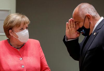 FILE PHOTO: Bulgarian Prime Minister Boyko Borissov gestures next to Germany's Chancellor Angela Merkel at the start of the first face-to-face EU summit since the coronavirus disease (COVID-19) outbreak, in Brussels, Belgium July 17, 2020. Stephanie Lecocq/Pool via REUTERS/File Photo