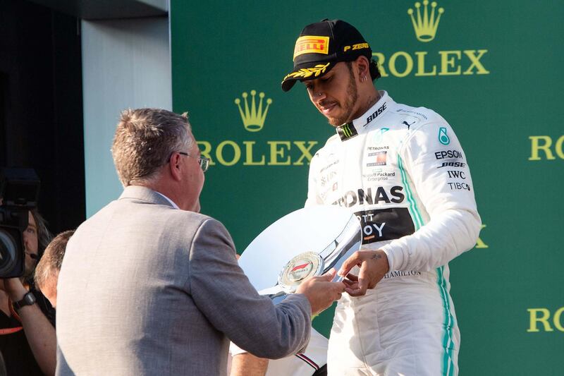 ALBERT PARK, VIC - MARCH 17: Mercedes-AMG Petronas Motorsport driver Lewis Hamilton (44) receives the second place trophy at The Australian Formula One Grand Prix on March 17, 2019, at The Melbourne Grand Prix Circuit in Albert Park, Australia. (Photo by Speed Media/Icon Sportswire via Getty Images)