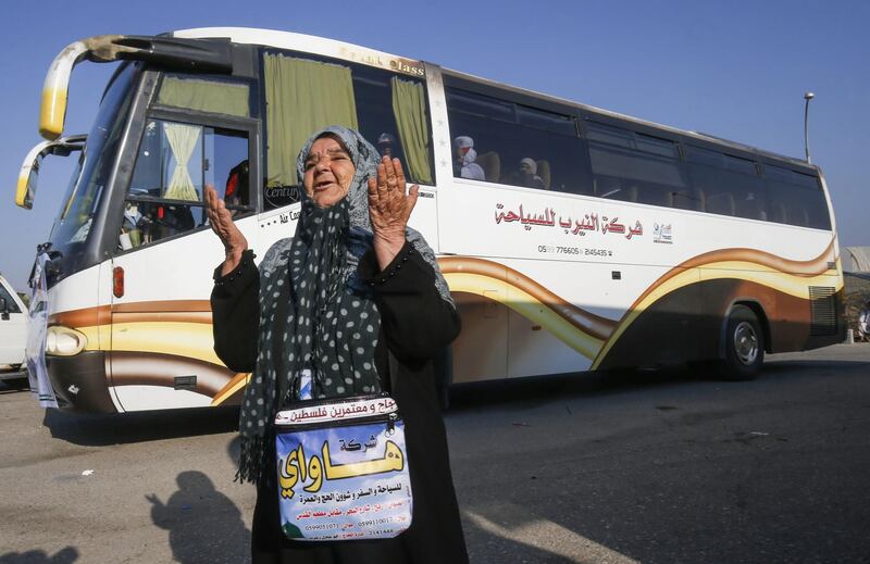 A Palestinian pilgrim prays before boarding the bus at the Rafah border crossing between the Gaza Strip and Egypt.  AFP