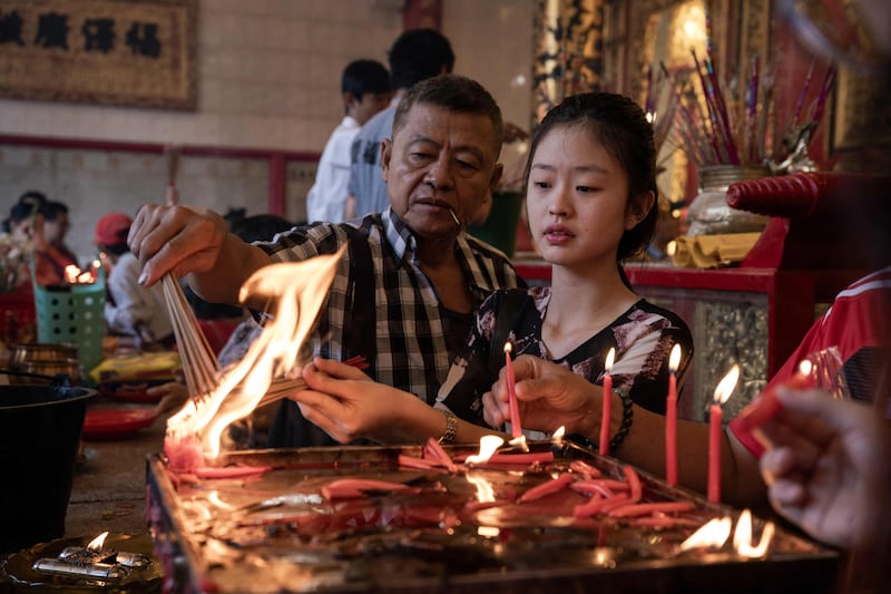 Incense is burned at a Chinese temple in the Chinatown area of Yangon, Myanmar, on the first day of the Lunar New Year of the Dragon. AFP