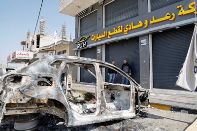 A burnt-out car after the Israeli settlers' rampage in Hawara, in the Israeli-occupied West Bank.  Reuters