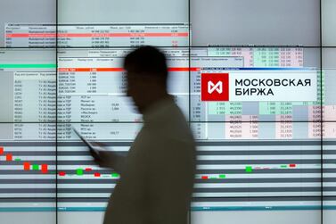 A visitor passes the OAO Moscow Exchange in Russia. Russia's equity market performed the best globally on a total-return basis in dollar terms. Bloomberg