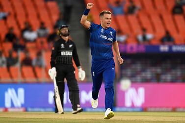 AHMEDABAD, INDIA - OCTOBER 05: Sam Curran of England celebrates the wicket of Will Young of New Zealand during the ICC Men's Cricket World Cup India 2023 between England and New Zealand at Narendra Modi Stadium on October 05, 2023 in Ahmedabad, India. (Photo by Gareth Copley / Getty Images)