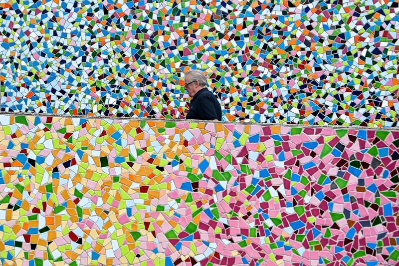 A man walks up a staircase tiled with mosaics at the Rhine promenade in Duesseldorf, Germany. EPA