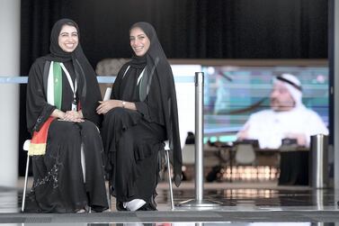 Volunteers Hessa Al Hamadi and Ashwaq Al Messabi take a short break at Adnec. Victor Besa / The National