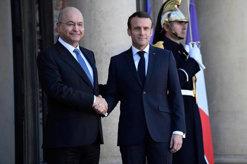 epa07396653 French President Emmanuel Macron shakes hands with Iraqi's President Barham Saleh upon his arrival for their meeting at the Elysee Palace in Paris, France, 25 February 2019.  EPA/JULIEN DE ROSA