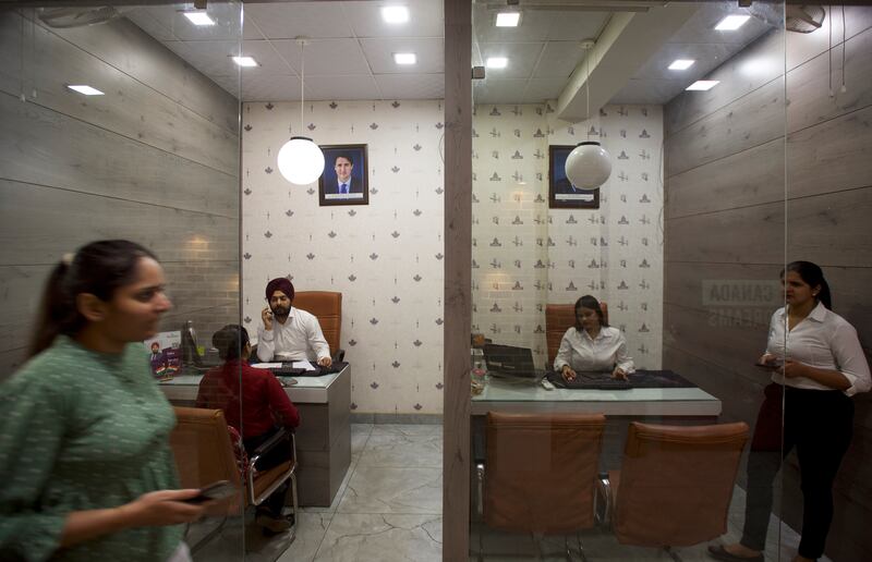 The service at immigration consultancies such as Broadway Immigration Service in Jalandhar costs about 100,000 rupees ($1,200) 