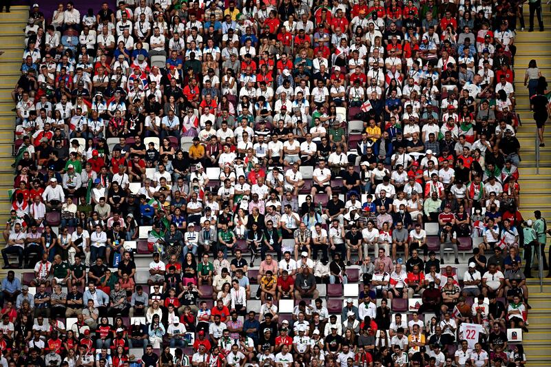 Supporters attend the Qatar 2022 World Cup Group B football match between England and Iran at the Khalifa International Stadium in Doha. AFP
