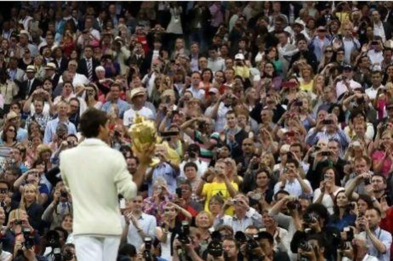 Roger Federer got his hands on a seventh Wimbledon trophy, equal with his idol Pete Sampras.