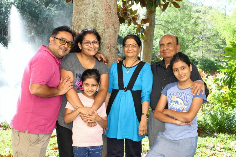 Kinjal Tanna, left, says Covid-19 has hit several families who have lost their parents. His father Jagdish Tanna, second right, had never spent a day in the hospital during more than 40 years of working in the Emirates until he was struck with the coronavirus. Courtesy: Tanna family
