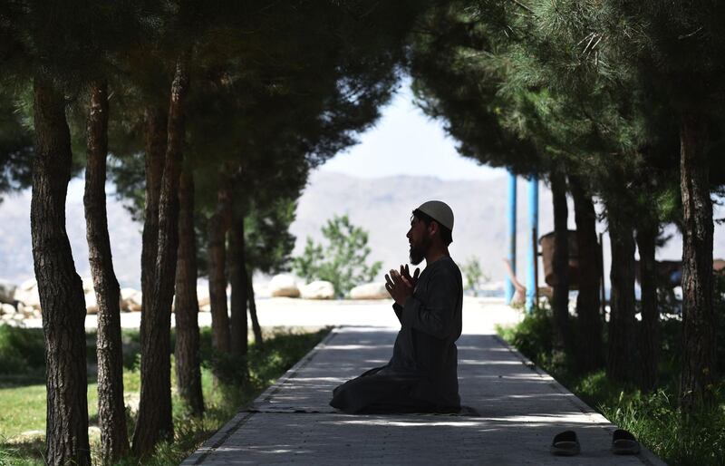 An Afghan Muslim prays during the holy month of Ramadan at the Wazir Akbar Khan hilltop in Kabul. Wakil Kohsar / AFP