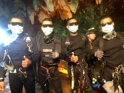 epa06878441 A handout photo made available by Thai Navy SEAL facebook page on 10 July 2018 shows the last four of Thai Navy Seals members, who stayed with the youth soccer team and their assistant coach inside a cave until they all were rescued, at the Tham Luang cave, Khun Nam Nang Non Forest Park in Chiang Rai province, Thailand, 10 July 2018. According to reports, all 12 boys of a child soccer team and their assistant coach have been rescued and evacuated to a hospital. The 12 youth and their assistant coach have been trapped in Tham Luang cave since 23 June 2018.  EPA/ROYAL THAI NAVY / HANDOUT  HANDOUT EDITORIAL USE ONLY/NO SALES