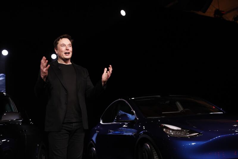 Elon Musk, co-founder and chief executive officer of Tesla Inc., speaks during an unveiling event for the Tesla Model Y crossover electric vehicle in Hawthorne, California, U.S., on Friday, March 15, 2019. Musk said the cheaper electric crossover sports utility vehicle (SUV) will be available from the spring of 2021. The vehicle's price will start at $39,000, a longer-range version will cost $47,000. Photographer: Patrick T. Fallon/Bloomberg